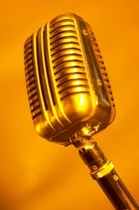 Antique silver microphone in orange light uid
